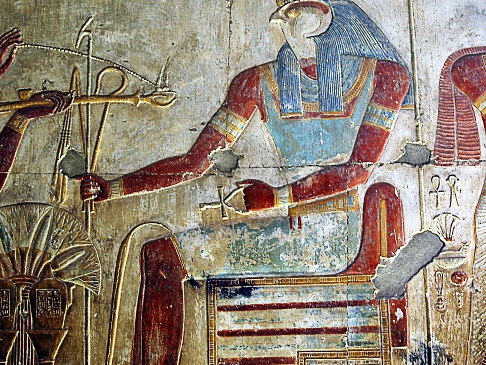 A deeply carved, painted relief of the falcon-headed god Horus inside the Temple of Seti I at Abydos — among the finest raised relief work to survive from ancient Egypt.