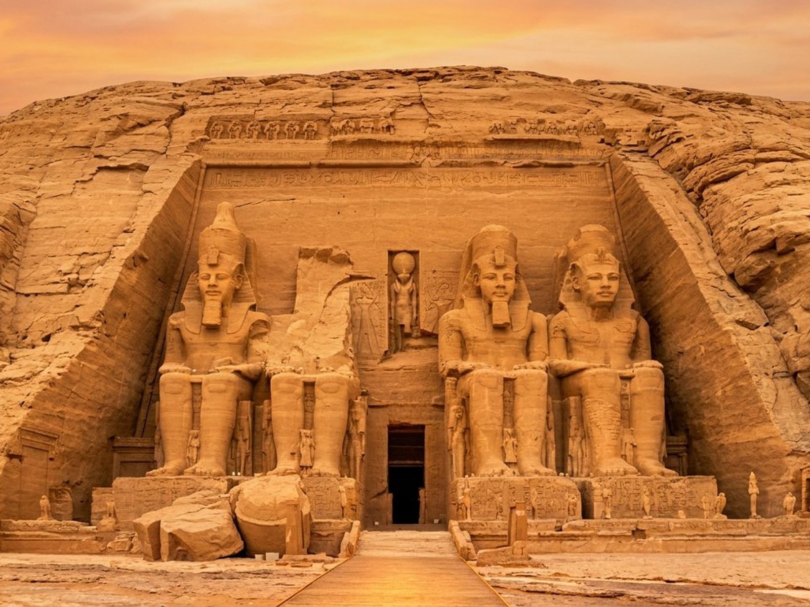 The facade of the Great Temple of Abu Simbel, carved directly into the sandstone cliff.